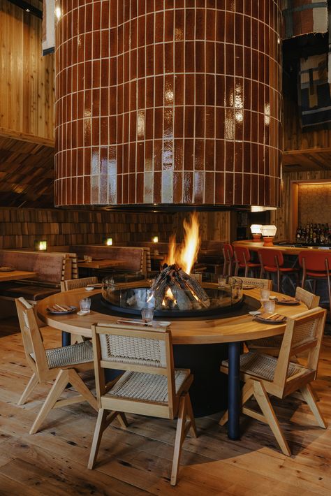 Floating fireplace design in a restaurant. Karaoke Room, Japanese Dining, Noodle Bar, Banff Alberta, Glazed Ceramic Tile, Booth Seating, Sushi Restaurant, Bbq Restaurant, Bar And Restaurant