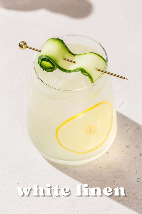 The White Linen cocktail is a crisp and refreshing gin cocktail! With St Germain elderflower liqueur, lemon juice, and fresh cucumber, this tasty recipe is perfect for summer. Elegant enough for a garden party, but simple enough to enjoy at home on a lazy summer afternoon. This is such a good poolside drink, but it would also go so well as a wedding signature cocktail. Cheers! White Linen Drink, Lemon Gin Cocktail, Gin Lemon Cocktail, White Linen Cocktail, Lemon Cocktail, Signature Cocktails Wedding, Fresh Cucumber, Gin Lemon, Gin Drinks