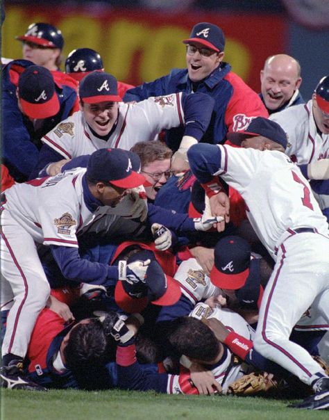 In this Oct. 28, 1995, file photo, the Atlanta Braves celebrate their 1995 World Series win against the Cleveland Indiants at Atlanta Fulton County Stadium in Atlanta. After a one-year delay caused by the 7 and a half-month players' strike, the expanded playoffs began in 1995, when teams played a 144-game schedule because of the walkout. The top teams met that October, with Atlanta defeating Cleveland in six games. (AP Photo/Andrew Innerarity, File) Braves World Series 2021, Funny Golf Pictures, Atlanta Braves Wallpaper, Georgia Peaches, Atlanta Braves World Series, Baseball Pitching, Atlanta Braves Baseball, Baseball Teams, Chop Chop