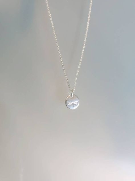 "This teenie tiny sterling silver dragonfly charm is so sweet and delicate, it is a perfect every day necklace. The 6mm charm is solid sterling with a tiny dragonfly impression. The charm hangs from a small but strong sterling silver chain and is shown in 17\" length. *If you are unsure of the length you need, or would like to wear this item at different lengths, we now offer an adjustable length option! You can add an adjustable end to your necklace using this link: https://www.etsy.com/listing Sterling Silver Dragonfly Necklace, Silver Dragonfly Necklace, Silver Jewlery, Silver Necklace Simple, Dragonfly Charm, Dragonfly Necklace, Dope Jewelry, From Santa, Jewelry Lookbook