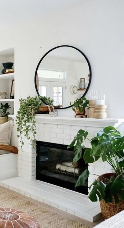 Mantle Decor Circle Mirror, Mantle With Circle Mirror, Black Round Mirror Over Fireplace, Plants For Fireplace Mantle, Round Mantle Mirror, Modern Boho Mantle Decor, Black Mirror Fireplace, Decorating A Long Mantle, Mantel Decor With Round Mirror