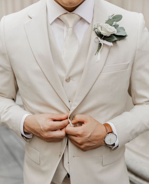 Set the tone with tone-on-tone. Layer of creamy tan, brown, white, and champagne create a look that's decadently dressed-up. Neutral Wedding Suit Groom, Light Colored Mens Suit, Cream And Blue Wedding Suits, Suits Men Wedding White, Champagne Best Man Suit, Mens Taupe Suit Wedding, White And Champagne Groom Suit, Wedding Tuxedo For Men Cream, Wedding Suits Groom Cream