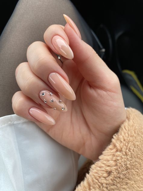 Minimalist Gem Nails, Almond Nails With Rhinestones Classy, Nude With Rhinestone Nails, Nude Nails Rhinestones, Nude Rhinestone Nails, Nude Acrylic Nails With Rhinestones, Nails Gems Rhinestones, Nude Nails With Gems, Nude Nails With Diamonds