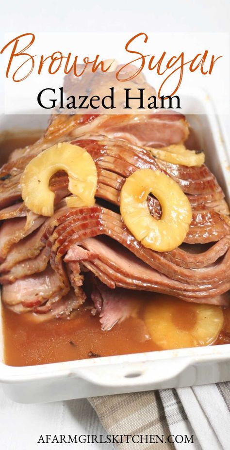 Delicious spiral cut ham slow cooked in the oven with brown sugar, pineapple slices, and cloves. This delicious glazed ham is perfect for holiday dinners. #holidayrecipes #honeyham #glazedham #brownsugarham #hamrecipes #dinnerrecipes #easyrecipe Ham Brown Sugar Pineapple, Pineapple Glazed Ham, Brown Sugar Glazed Ham, Cooking Spiral Ham, Honey Ham Glaze Recipe, Spicy Ham, Brown Sugar Pineapple, Sugar Ham, Spiral Cut Ham