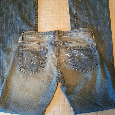 Bebe Swarovski Jeans Price Firm New With Tags Light Denim Size 28 Inseam 34" Leg Opening 10" Minimal Stretch 98% Cotton 2% Spandex Swarovski (Clear) Crystals On Butt And Pocket Loops 5 Pocket Boot Cut Low Rise Flare Never Worn! No Missing Stones (Extra Stones Included) Size Guide In Pictures *No Trades Please * Low Rise Jeans 2000s, 2000s Pants, Ultra Low Rise Jeans, Baggy Jeans For Women, Bebe Jeans, Light Denim Jeans, Low Rise Flare Jeans, Leopard Print Jacket, Poshmark Finds