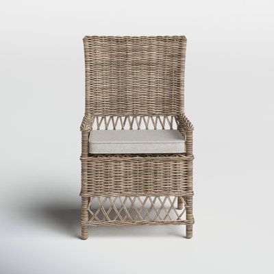 Something we love about this wicker dining chair is how its beautiful, intricately woven rattan instantly elevates any coastal cottage dining room without a whole lot of fuss. It's thoughtfully crafted with a sturdy wicker frame that holds up to 300 lbs. while resisting sagging over time, and its thick fabric-covered cushion provides the comfort that you and your loved ones deserve. We love its openwork cross-back details and how its rich woodgrain texture is sure to fit right in with your class Cottage Dining, Wicker Dining Chairs, Taupe Rug, Kitchen Mirror, Grey Wash, Kitchen & Dining Chairs, Birch Lane, Wicker Chair, How To Distress Wood