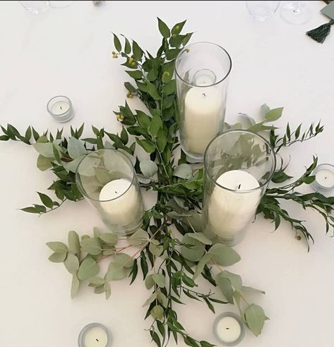 Cylinder vases with a simple bed of fresh ruscus and eucalyptus. Botanical Wedding Decor, Eucalyptus Centerpiece, Botanical Center, Olive Wedding, Wedding Timeless, Events Center, Circle Table, Pioneer School, Twinkly Lights