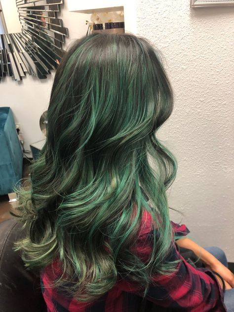 Skunk Hair Dye Green, Green And Brown Hair Aesthetic, Dimensional Green Hair, Green Hair Strands, Dark Green Highlights In Brown Hair, Brown To Green Ombre Hair, Green Highlights Brown Hair, Green Streaks In Hair, Forest Green Highlights