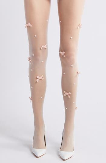 Hand-sewn with dainty bows and lustrous imitation pearls, these sheer tights add pretty sweetness to any ensemble. Elastic waist Nylon Hand wash, dry flat Imported Fitted Party Hosiery With Bow, Thigh High Party Hosiery With Bow, Tights With Bows, Bow Tights, Pearl Fishnet Tights, Coquette Tights, Kawaii Tights, Coquette Thigh Highs, Cute Tights