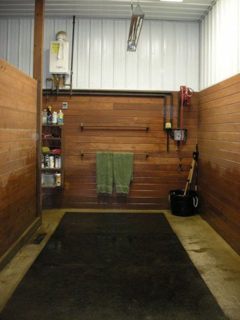 Generally, I like the design of this wash stall. I might have a larger drainage grate along the wall and, since there appears to be another wash stall on the other side, raise the partition about 6 inches to let the water from both sides flow into the drain without eventually damaging the wood. Also, I'd include a spray boom to keep the hose out of the way. Tack Room Organization, Horse Tack Rooms, Barn Layout, Horse Farm Ideas, Barn Hacks, Cattle Barn, Horse Barn Ideas Stables, Barn Stalls, Stable Ideas