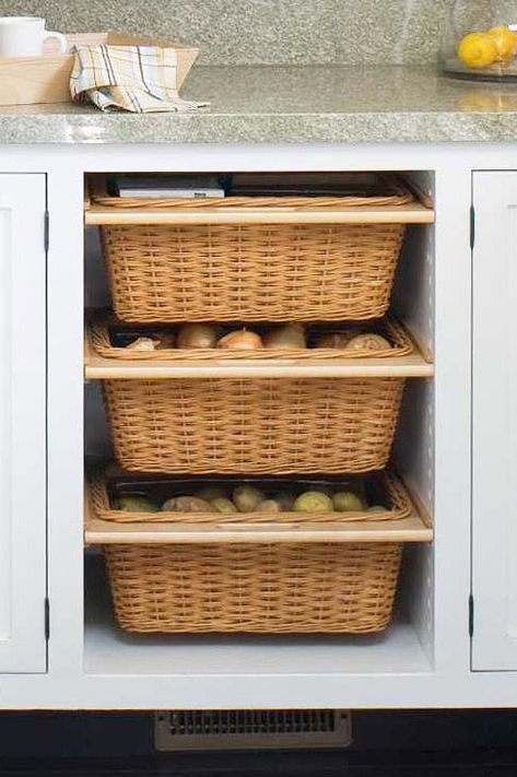 Redoing your kitchen cabinets? Consider adding a couple of slide-out baskets, which are ideal for storing vegetables that don't need to be refrigerated, such as onions and potatoes. #organization #storageideas #kitchenorganization #bhg Barndoor Hardware, Island Storage, Onion Storage, Kitchen Island Storage, Produce Storage, Kabinet Dapur, Kitchen Necessities, Vegetable Storage, Diy Kitchen Storage