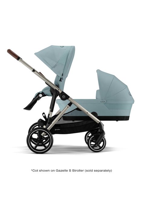 This comfy cot is an ideal travel solution for your little one from birth.Why parents will love it: As your family grows, convert the CYBEX Gazelle S (sold separately) from a single to a double stroller with the Gazelle S Cot, allowing an infant and toddler to ride at the same time. It has an ergonomic carry handle and memory buttons that make placement and removal from the stroller frame achievable with one hand.Why kids will love it: With an interior lining that is as warm and comfortable as cotton, this cot is not only spacious but also offers a covered resting spot for your baby while out for a stroll.Maximum child weight/height: Use from birth up to 20 lb.Weight/dimensions: 9.4 lb.; 33"L x 16"W x 20.5".Stroller compatibility: CYBEX Gazelle S (sold separately). One-hand XXL sun canopy Cybex Gazelle, Double Stroller, Sun Canopy, Double Strollers, Little One, Stroller, Nordstrom, Parenting