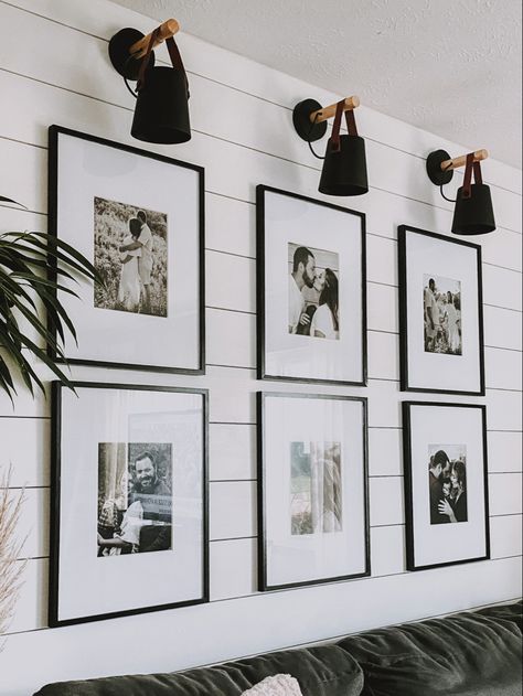 Photo Wall With Black Frames, Matte Picture Frame Ideas, Lighted Photo Wall, Black Wall With Pictures, Black Framed Pictures On Wall, 6 Black Frames On Wall, Bedroom Photo Gallery Wall, Gallery Wall Black And White And Color, Large Black Picture Frames On Wall