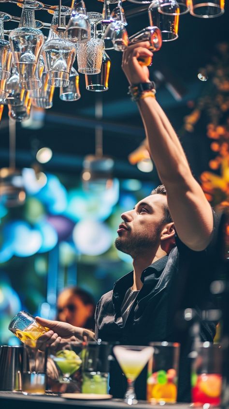 Bartender in Action: A skilled bartender reaches for a glass, preparing a drink with focus and expertise in a vibrant bar. #bartender #bar #cocktail #glassware #nightlife #mixology #drinks #service #aiart #aiphoto #stockcake https://ayr.app/l/BSTB Bartender Photoshoot Ideas, Bartender Aesthetic Male, Male Bartender, Harlow James, Bartender Photography, Bartenders Photography, Lauren Blakely, Mixology Drinks, Action Images