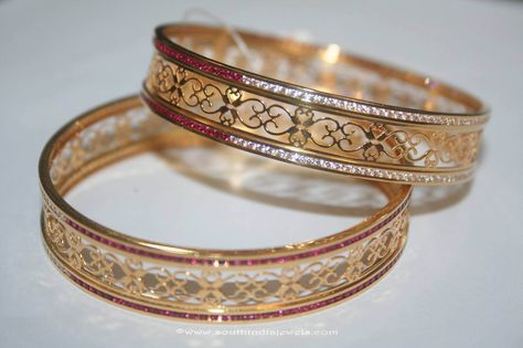 22k gold bangles studded with white and red stones.  For inquiries please contact the seller below. Seller Name : Prakruthi  Vummudi Bangaru Store Contact No : +91-44-4350-4460/+91-98840-72021 Website      : http://vbprakruthi.com/ Email         : info@vbprakruthi.com More CollectionsGold Simple Daily Wear Bangles from PrakurthiGold Ruby Emerald Bangle from PrakruthiGold Designer KanganGold Pearl Ruby DropsSimple Gold Jhumki From Prakruthi50 Plain Gold Bangles, 22k Gold Bangles, Gold Bangles Indian, Gold Bangles For Women, Antique Gold Jewelry Indian, Gold Bangle Set, Red Stones, Real Gold Jewelry, Bangles Indian