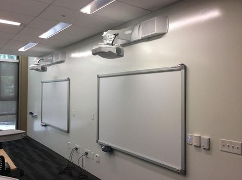 Two EPSON ultra short throw projectors both mounted to the wall in more of a conference room setting. Ceiling Home Design, Classroom Presentation, Projector Ideas, Ultra Short Throw Projector, Projector Setup, Benq Projector, Projector Ceiling, Projector Ceiling Mount, Theater Rooms