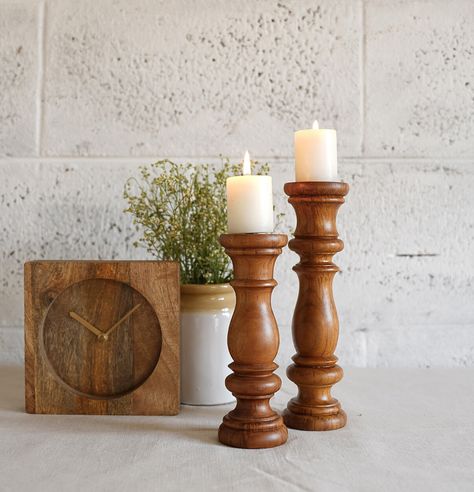 illuminate your home decor with our handcrafted teak wooden candle stands. This set of two merges heritage with modern design, adding timeless elegance to any space. Shop now for this exquisite addition at thoppia.com or visit our JP Nagar store in Bangalore! #teakwood #handcrafted #handmade #homedecor ##decorıdeas #interiordesign #sustsinableliving #homeinterior #teak #home #minimal #premium Wooden Candle Stand, Candle Stands, Home Minimal, Wooden Candle, Candle Stand, Teak Wood, Bangalore, Timeless Elegance, Teak