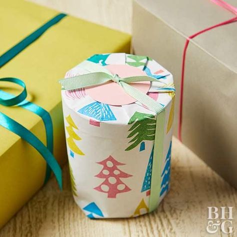 This easy gift idea is the perfect stocking stuffer or small present. Plus, we'll show you how to make handmade wrapping paper. #diygifts #christmas How To Wrap A Candle Gift, How To Wrap A Candle, Diy Stamped Wrapping Paper, Wrap A Candle, Stamped Wrapping Paper, Gift Wrapping Candles, Christmas Present Wrap, Easy Gift Idea, Handmade Wrapping Paper