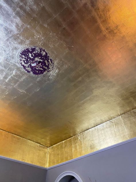 We used imitation gold leaf to create a swoon-worthy gold ceiling in our new cocktail bar. Click through to find out how. Gilded Ceiling Gold, Black Walls Gold Ceiling, Gold Ceiling Bathroom, Gold Leaf Interior, Gold Leaf Ceiling Diy, Gold Ceiling Paint Ideas, Gold Painted Ceiling, Gold Ceiling Paint, Gold Wallpaper Ceiling