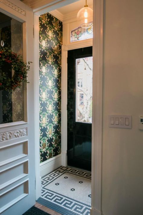 Vintage panels in the transoms above the windows were restored by The Stained Glass Store in Park Slope. Another, with a house number, was newly made for the space above the entry door. Floral wallpaper in the entry vestibule came from Rifle Paper Co. Heather Strommen, Brownstone Interiors, Entryway Tile, Entry Tile, Small Entrance, Brooklyn Brownstone, Entry Hallway, Row House, Entry Foyer