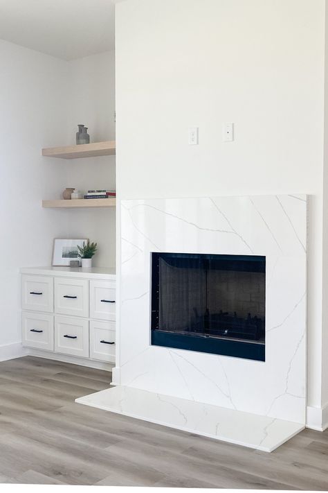 Quartz Fireplace Surround, Quartzite Countertops Taj Mahal, Quartz Fireplace, White Fireplace Surround, Popular Flooring, Modern Fireplace Mantels, Fireplace Modern Design, Minimalist Fireplace, Built In Around Fireplace