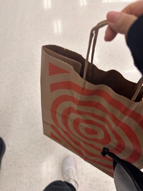 A hand holding a target bag. Influencer Ideas, Target Aesthetic, Aesthetic Self Care, Life In Usa, Target Shopping, Romanticize Your Life, Micro Influencer, Aesthetic Logo, Influencer Lifestyle