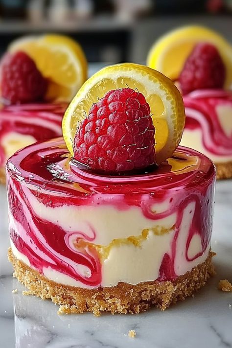 Luscious Lemon Raspberry Swirl Cheesecake Cups Individual Cheesecake Cups, Individual Cheesecake, Golden Oreo Crust, Lemon Oreos, Raspberry Swirl Cheesecake, Individual Cheesecakes, Swirl Cheesecake, Golden Oreo, Cheesecake Cups