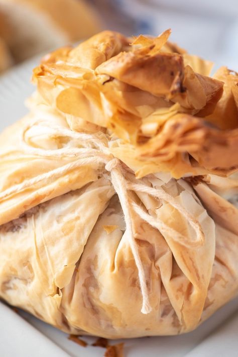 Baked phyllo dough wrapped around brie cheese, tied with kitchen twine Phylo Pastry Recipes, Philo Dough, Brie Recipes Appetizers, Brie Cheese Recipes, Turkey And Stuffing, Phyllo Dough Recipes, Phyllo Recipes, Bread Stuffing, Turkey Cranberry