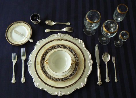 Formal place setting with oyster fork on the right and dessert fork and spoon above the charger Proper Place Setting, Proper Table Setting, Formal Dinner Table, Formal Table Setting, Oyster Fork, Dinner Places, Dining Etiquette, Table Manners, Etiquette And Manners