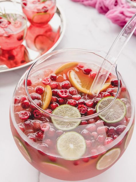 A punch bowl with a tray of drinks next to it. Punch With Cranberry Juice, Cranberry Juice Pineapple Juice, Mexican Punch, Sangria Party, Sparkling Punch, Grinch Punch, Cranberry Cider, Cranberry Punch, Holiday Hacks