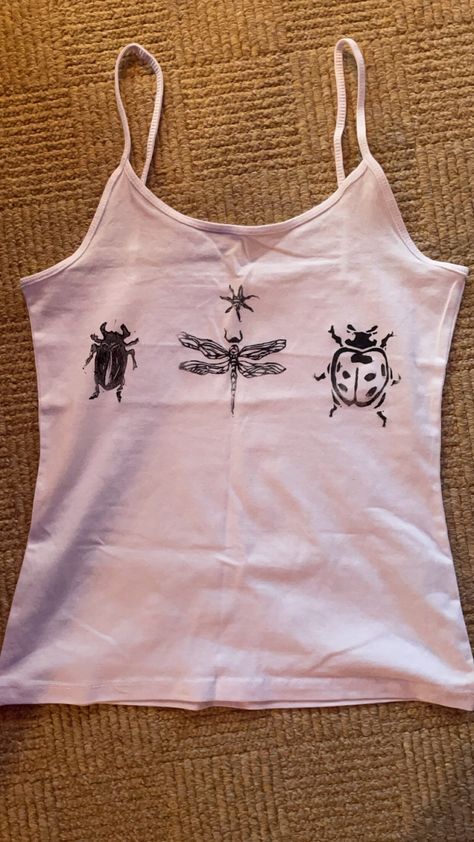 hand printed insect tank top / cami made using lino and fabric ink. lovely unique insect design showing a beetle, dragonfly, ladybird, and a little star. sizes XS-XL are available, and item is made to order so let me know your size. very fashionable, one of a kind, cute and comfy Crafts For Clothes, Grunge Tank Top Diy, How To Put Print On Shirt, Homemade Graphic Tees, Fashion Items Accessories, Doodle T Shirt, Cool Diy Shirts, Shirt Prints Ideas, Simple Screen Print