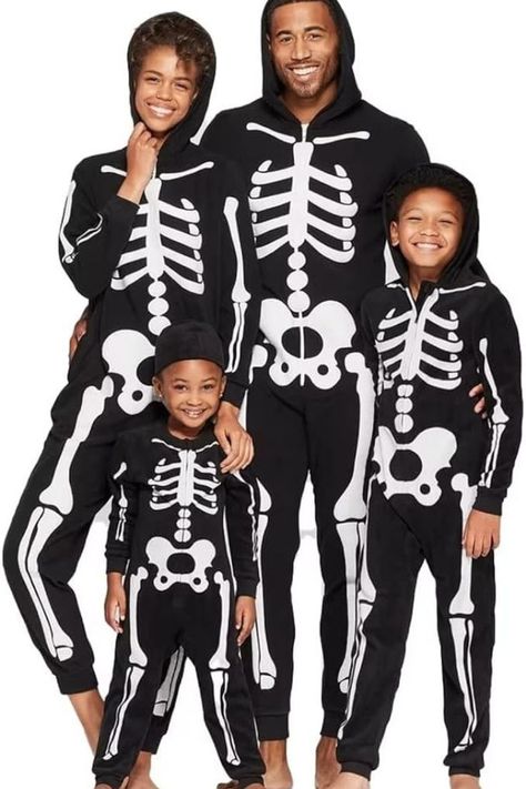 Family Halloween Costumes for 3: Matching family costumes featuring unique glowing skeleton printed on front bodysuit, which add lots of fun to your Halloween party and other theme activities. Suggested to put this jumpsuit under the light/sun for 15 to 30 mins, then put it on in the dark, the glowing effect will be better to make you look scary. It is sure to be the hit of your Halloween party. As an Amazon Associate I earn from qualifying purchases. Halloween Onesie Costumes, Skeleton Costume Kids, Skeleton Halloween Costume, Skeleton Hoodie, Hoodie Costume, Family Pajama Sets, Halloween Family, Matching Costumes, Skeleton Costume