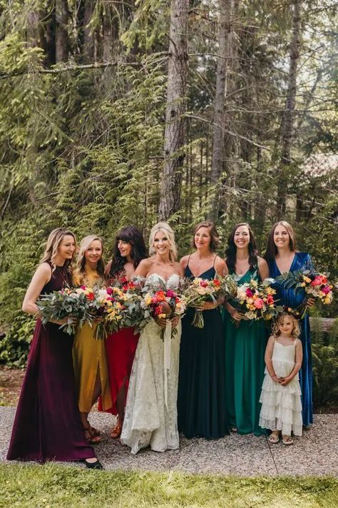 super bold jewel tone maxi bridesmaid dresses in deep purple, mustard, red, navy and emerald plus electric blue are gorgeous for the fall Shades Of Blue Bridesmaid Dresses Color Schemes, Bridesmaids In Different Colors, Summer Colors For Wedding, Multi Color Bridesmaid Dresses Fall, Jewel Toned Bridesmaid Dresses, Colorful Wedding Bridesmaids, Colourful Bridesmaid Dresses, Oxblood Wedding, Different Color Bridesmaid Dresses