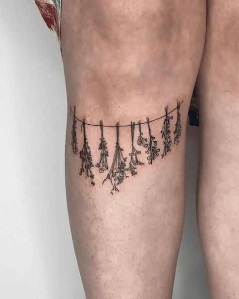 Ready to elevate your tattoo game? Explore these 60 stunning aesthetic tattoo ideas that will grab everyone's attention. From delicate designs to bold statements, find inspiration for your next ink masterpiece. #tattooideas #inkinspiration #tattooart Thigh Tattoos Inspiration, Hanging Herbs Tattoo, Elegant Matching Tattoos, Herb Tattoo Ideas, Thigh Tattoos Women Aesthetic, Key Tattoo Designs For Women, Thigh Tattoos Unique, Tattoo Ideas To Draw, Matching Thigh Tattoos