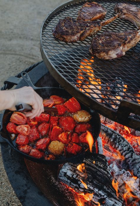 This year, get outside and get cooking with the Kettle-style Fire Pit. From grilling juicy cuts of meat to sizzling fresh veggies with your Side Kick, there’s endless possibilities to play around with new recipes and cooking methods over the fire. Delicious outdoor cooking awaits! Find your new outdoor cooking setup today at seaislandforge.com #SeaIslandForge #SeaIslandForgeLife #SIFKettle #OutdoorFirePit #OutdoorCooking #ByTheFire #ForgeCooking #HandForged #OpenFireCooking #Grilling Outside Cooking, Fire Pit Cooking Grill, Pit Cooking, Fire Pit Cooking, Open Fire Cooking, Side Kick, Fire Pit Grill, Fire Cooking, Open Fire