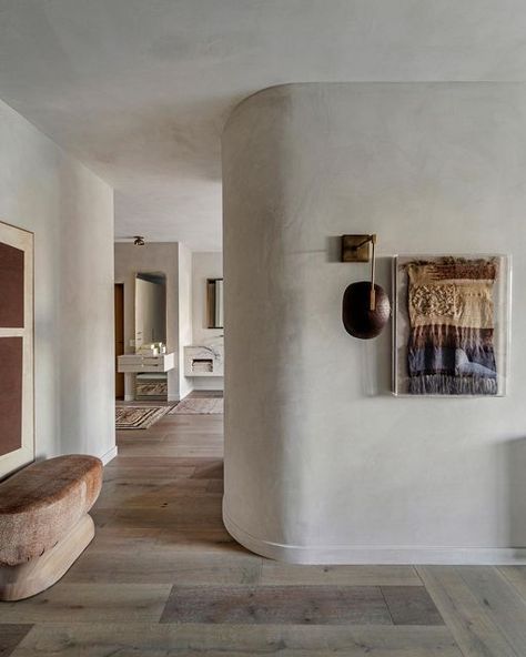 Anne-Marie Barton, AMB Design on Instagram: "This art on the plastered bended wall from the bedroom to primary bath are both loud and subtle at the same time. Couldn’t have landed a better alliance of unique statement pieces." Concrete Effect Paint, Primary Bath, Plaster Wall Art, Statement Wall, Palm Desert, Anne Marie, Plaster Walls, Interior Design Art, The Bedroom