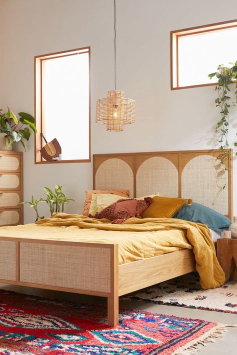 Looking to create a bohemian feel in your bedroom? One of the easiest ways to do so is with your bed. While there are many styles of boho beds, some o... | Go Retro with a Wood + Cane Bed Frame Tan Wood Bed Frame, Light Wood Bed Frame, Boho Bed Frame, Rattan Bed, Rattan Headboard, Beds And Headboards, Boho Bedding, Up House, Apartment Furniture