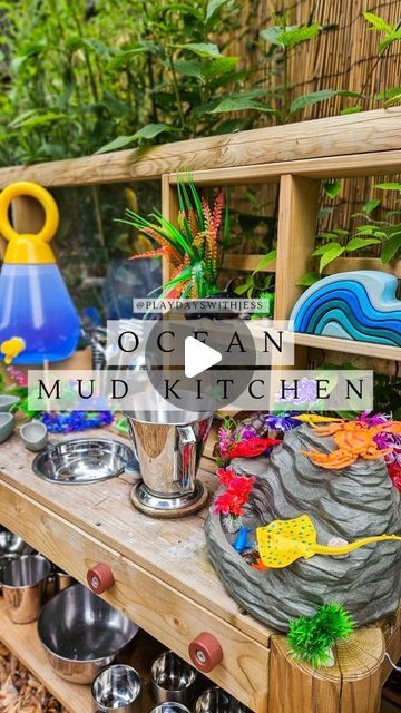 Jess Townsend on Instagram: "OCEAN MUD KITCHEN // 🌊🦀⛱️ I'M BACK with another themed Mud Kitchen, and this one was one of our favourites! This is our Ocean themed Mud Kitchen setup! Full of all things Ocean, beach and underwater themed!   MATERIALS USED: . Mud Kitchen @plumplayuk  . Pick n Mix Table, Counter Top and Tuff Spot @cosydirect  . Ocean Cloth @the.wonderie  . Sand, Seaweed, tickit shells, shells, shaving Foam and pasta.  . Water Dispenser @ikeauk  . @yellow_door_education waterfall and pourers - from @isaacs_treasures use PLAYDAYSWITHJESS10 for money off.  . Large sea creatures and coral - amazon  . Silverware - charity shops  Let me know in the comments what you think of this setup and tag a friend who would love this theme! You can also save this reel for future reference!   C Mud Kitchen With Water Dispenser, Kitchen With Water Dispenser, Outdoor Play Space, Kitchen Setup, Tuff Spot, Shaving Foam, Table Counter, Pasta Water, Yellow Door