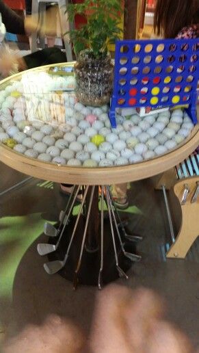 Golf ball table at OR show #keen What To Do With Old Golf Clubs, Golf Club Lamps, Diy Golf Ball Crafts, Golf Ball Art Projects, Golf Ball Decor, Old Golf Clubs Ideas Decor, Golf Ball Display Ideas, Diy Golf Ball Display, Golf Ball Display