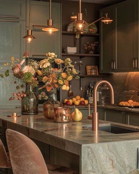 Cozy up your kitchen with a stunning marble island and deep olive cabinets. 🍃✨ Add warm lighting, copper accents, and fresh florals for the perfect blend of elegance and serenity. #KitchenInspo Copper Kitchen Island Lights, Copper Details Interior, Copper And Cream Kitchen, Copper Marble Kitchen, Bold Kitchen Countertops, Green And Bronze Kitchen, Sage And Copper Kitchen, Copper And Green Kitchen, Copper Accents Kitchen