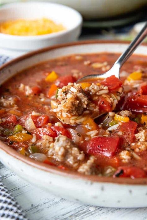 Stuffed pepper soup with sausage is a flavor-packed 20-minute meal made with sausage, peppers, and rice. Gluten-free. Stuffed Pepper Soup With Italian Sausage, Sausage Peppers And Rice, Peppers And Rice, Soup With Sausage, Sausage Soup Recipes, Sausage Peppers, Friends Recipes, Sauteed Peppers, Stuffed Pepper