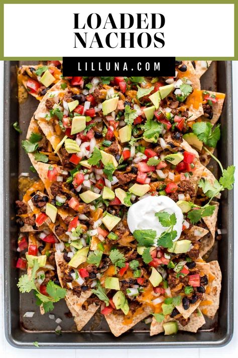 Piled high loaded nachos are the perfect game-day food or appetizer. They're easy to make and customize with your favorite nacho toppings! #loadednachos #nachos #nachotoppings #loadednachosrecipe #mexicanfood Loaded Nachos Recipe, Tomato Snacks, Nacho Toppings, Homemade Nachos, Nachos Recipe Easy, Lil Luna, Homemade Tortilla Chips, Loaded Nachos, Nachos Recipe