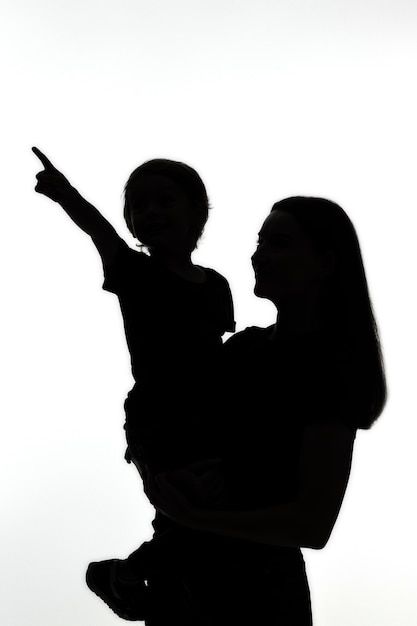 Classic portrait silhouette of mom and c... | Premium Photo #Freepik #photo #child-silhouette #profile-silhouette #mom-child #mom Mom And Son Silhouette, Mama Logo, Child Silhouette, Portrait Silhouette, Photo Classic, Mom And Child, Classic Portrait, Mother Son Photography, Kids Silhouette