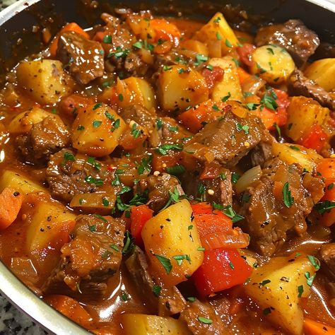 🍲🇩🇪 Savor the warmth of our German Goulash – hearty and delicious! #GermanCuisine #ComfortFood German Goulash Ingredients: Beef stew meat (2 lbs) Onions (2, sliced) Garlic (3 cloves, minced) Paprika (2 tbsp) Tomato paste (2 tbsp) Beef broth (4 cups) Red bell peppers (2, chopped) Carrots (2, sliced) Potatoes (3, cubed) Caraway seeds (1 tsp) Salt and pepper (to taste) Instructions: Brown beef in a large pot; remove. Sauté onions and garlic until soft. Stir in paprika and tomato paste; cook ... Goulash Aesthetic, German Stew, German Goulash, Sauté Onions, Food Reference, Carrots Potatoes, Instagram Recipes, Red Bell Peppers, Twisted Recipes