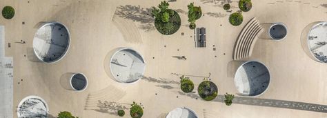 COBE architects' karen blixens plads is an urban plaza of bicycle hills + plants in copenhagen Tamizo Architects, Green Transportation, Karen Blixen, Architect Logo, Danish Architecture, Public Square, Bicycle Parking, Zaha Hadid, Bicycle Design