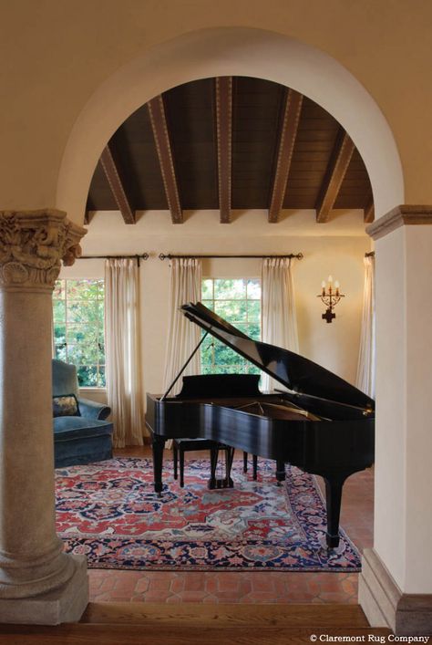 Striking Antique Serapi in Music Room  The splendor of this 120 year old Persian room size rug undoubtedly adds to the enjoyment of music played in this distinctive setting while aiding the fidelity of the sound. Antique Piano Decor, Rug Under Piano, Grand Piano Living Room, Piano Rooms, Mediterranean Family Room, Grand Piano Room, Bohemian Loft, Piano Room Decor, Piano Living Rooms