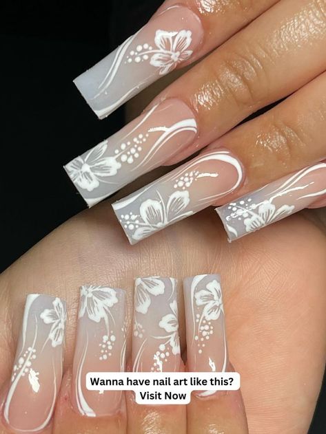 White nails are a classic winter nail color that is sleek and sophisticated. Try a sheer white for a minimalist look or go for a bold white for a more dramatic White Nails For Winter, Hibiscus Nail Art, Nails For Winter, Hawaiian Nails, Hawaii Nails, Acrylic Nail Designs Coffin, White Hibiscus, Diy Acrylic Nails, Colored Acrylic Nails