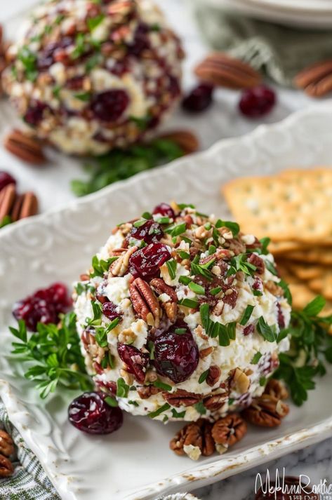 Indulge in a festive Cranberry Pecan Goat Cheese Ball, perfect for holiday gatherings! Creamy goat cheese blended with tart cranberries and crunchy pecans. #appetizer #holidayrecipe #cheeseball #cranberry #pecan Cranberry Pecan Cheeseball, Cranberry Cheeseball, Goat Cheese Ball, Cranberry Cheese Ball, Chicken Quesadillas Taco Bell, Cranberry Pecan Cheese Ball, Goat Cheese Balls, Gluten Free Party, Cheese Ball Recipe