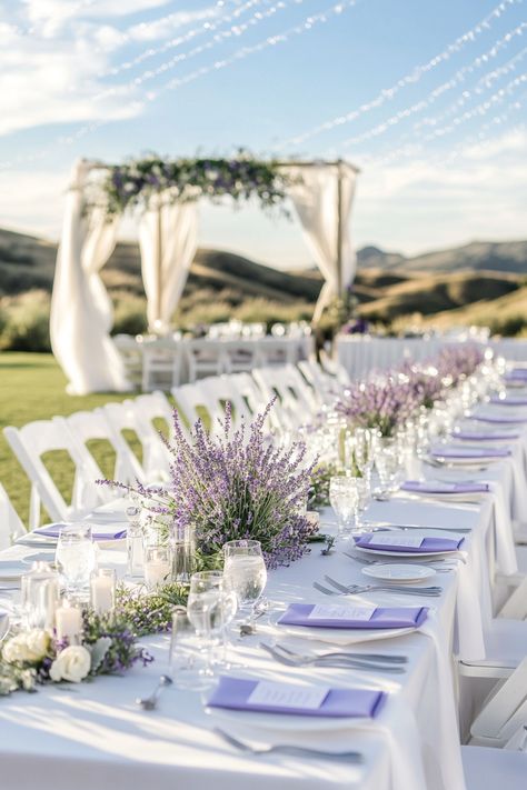 Elevate your big day with stunning lavender-themed wedding floral arrangements! These enchanting blooms add a touch of elegance and charm, creating an unforgettable atmosphere for you and your guests. Discover unique ideas and inspiration to make your wedding truly special!  #LavenderWedding #WeddingFloralArrangements #WeddingPlanning #BridalInspiration #WeddingDecor #WeddingFlowers #FloralDesign #UniqueBridalIdeas #RomanticWeddings #WeddingAesthetics #FloralInspiration #LavenderTheme #WeddingInspo #ElegantWeddings #BigDayBliss Wedding Venues Lavender, Lavendar Wedding Aesthetic, Lavender Backyard Wedding, Lilac Table Setting Wedding, Light Purple Wedding Decor, Lavendar Wedding Centrepiece, Lavender Wedding Florals, Lavender And Navy Blue Wedding, Navy And Lavender Wedding