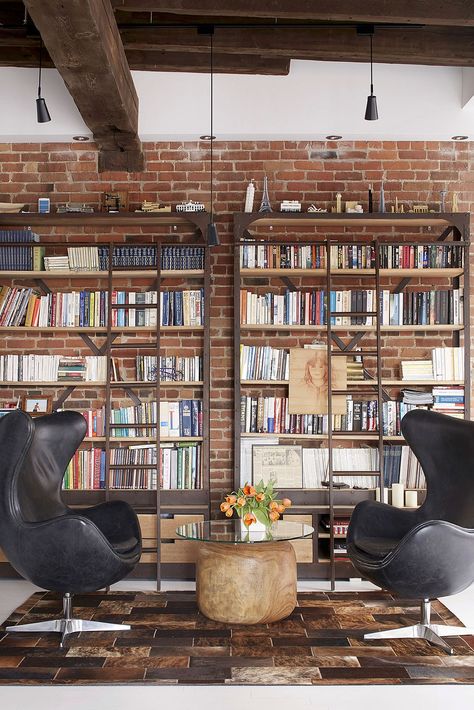 Home library with brick wall backdrop and comfy modern decor Home Library Design Ideas, Modern Industrial Loft, Home Library Decor, Brick Wall Backdrop, Home Library Rooms, Loft Industrial, Home Library Design, Industrial Interiors, Home Libraries